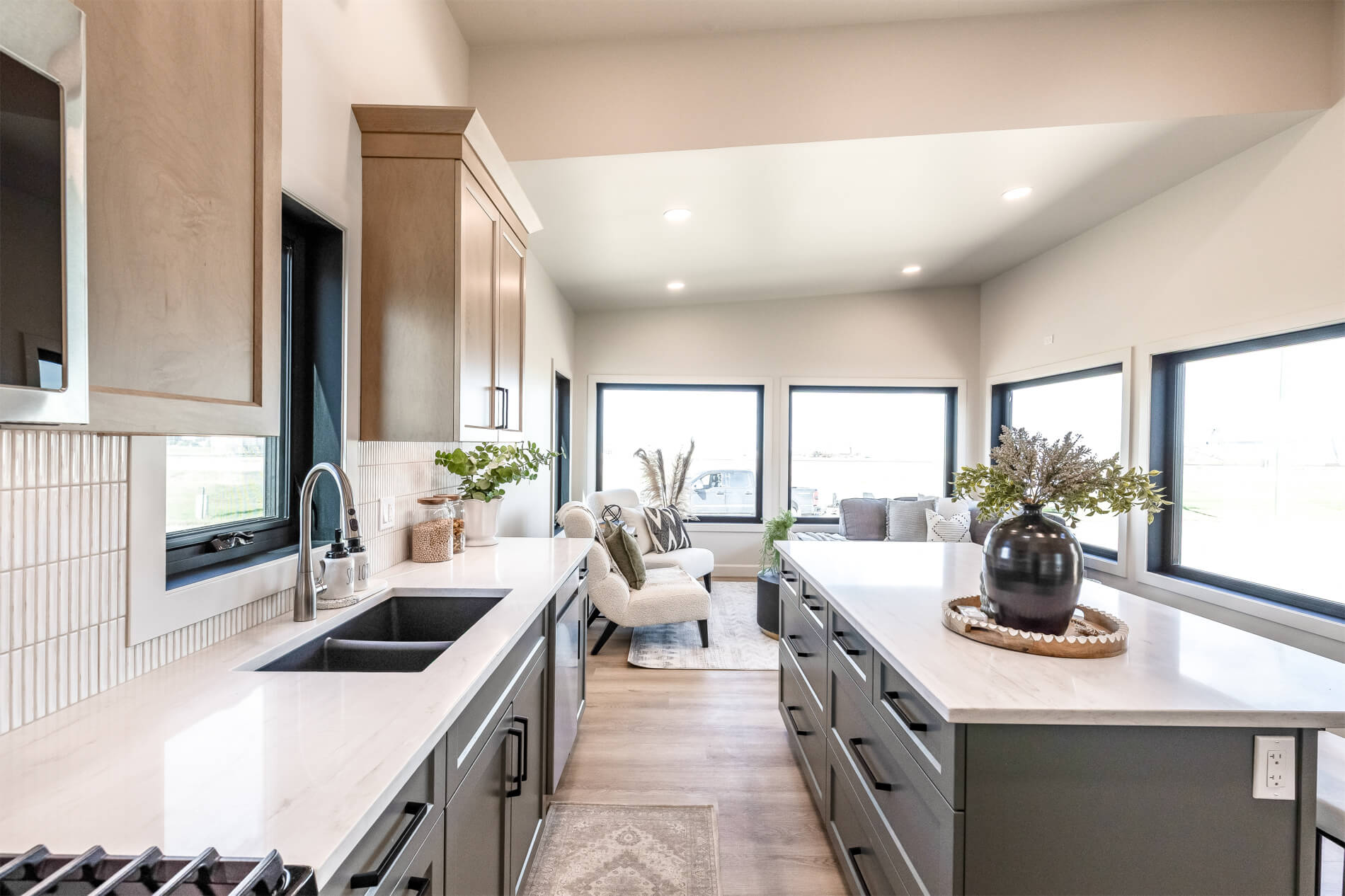 Open concept living area and kitchen with high ceilings in a tiny home