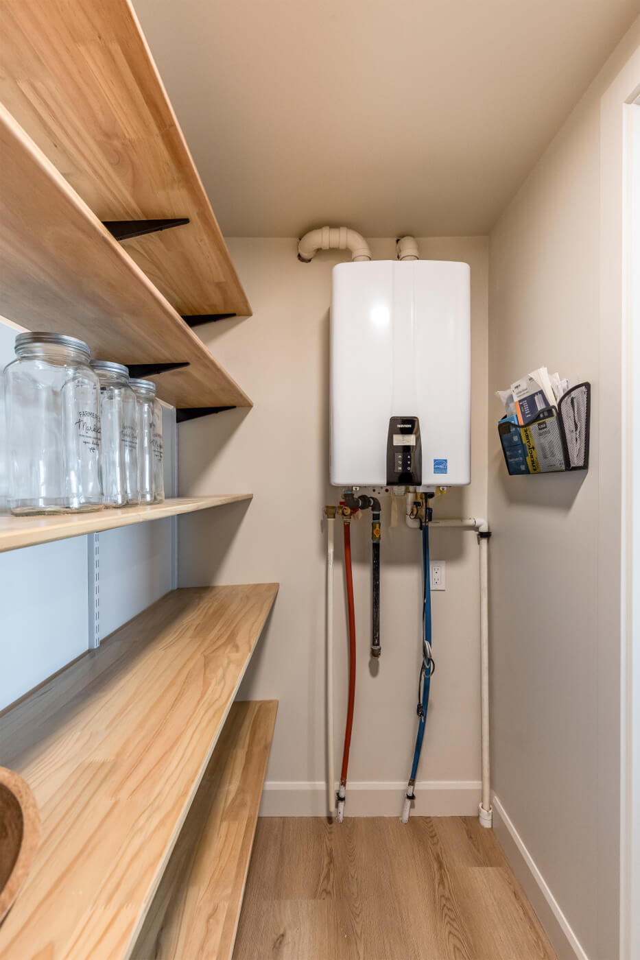 Walk in pantry with open shelving in a tiny home