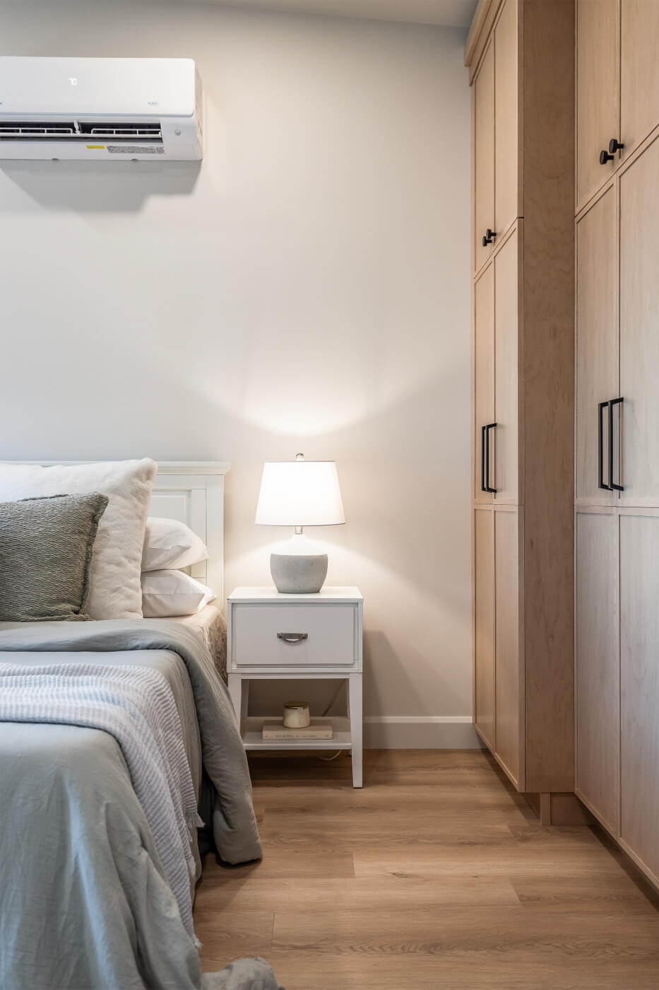 Tiny home master bedroom with ample storage and high celings