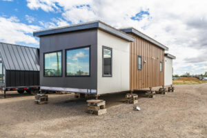 Tiny home exterior with large windows and wood accents