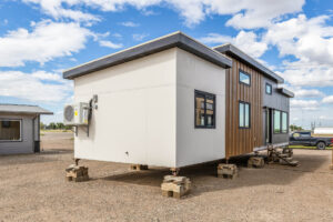 Tiny home exterior with large windows and wood accents