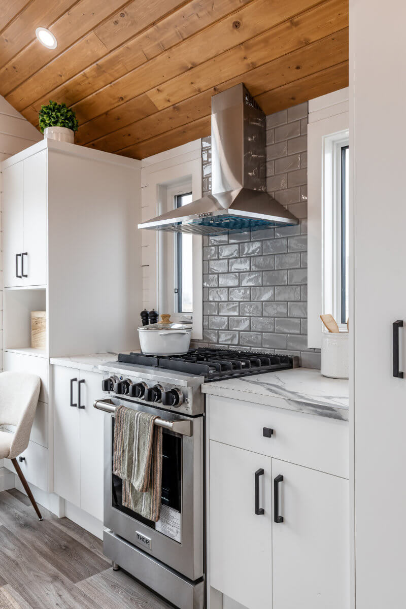 Tiny home kitchen with ample storage and modern fixtures