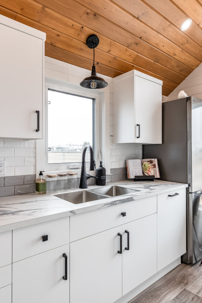 Tiny home kitchen with ample storage and modern fixtures