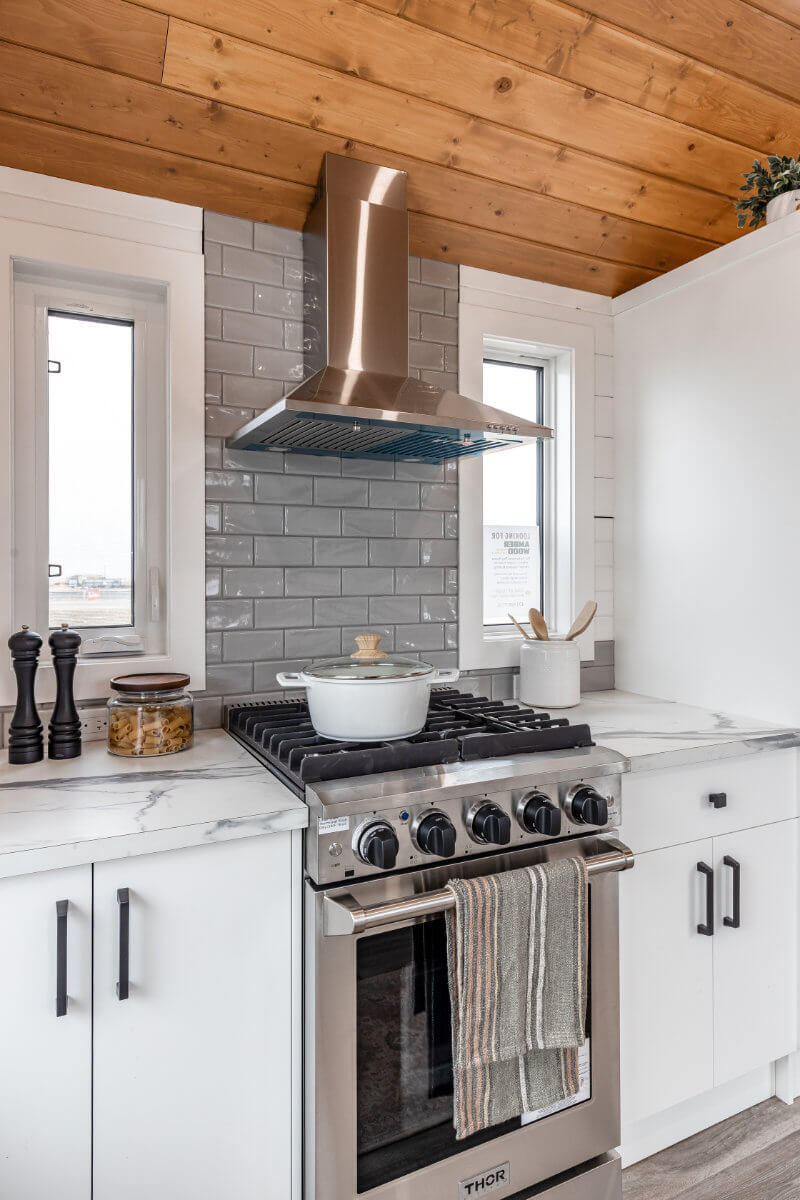 Tiny home kitchen with ample storage and modern fixtures